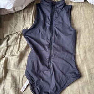 Black zip up SKIMS swimsuit
